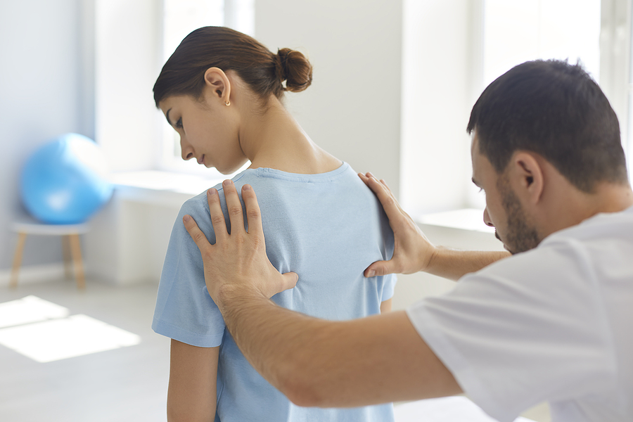Woman getting treated by a chiropractor in Baulkham Hills